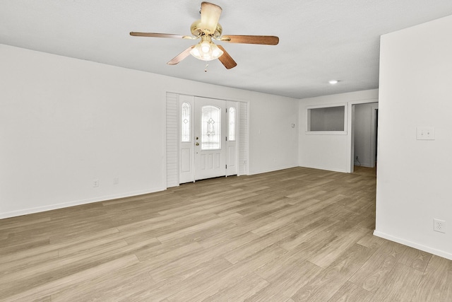 entrance foyer with ceiling fan and light wood-type flooring