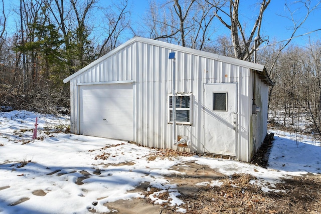 view of snow covered garage