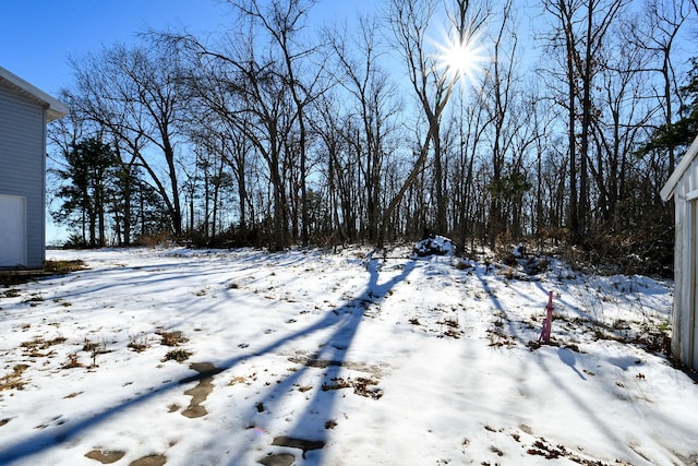 view of yard layered in snow