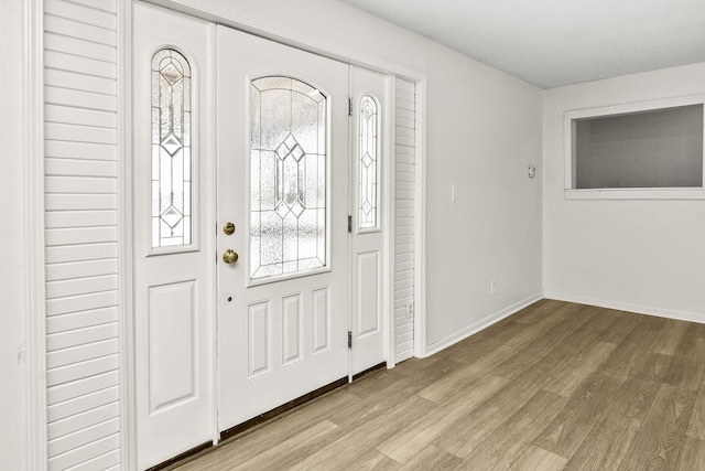 entrance foyer with light hardwood / wood-style floors