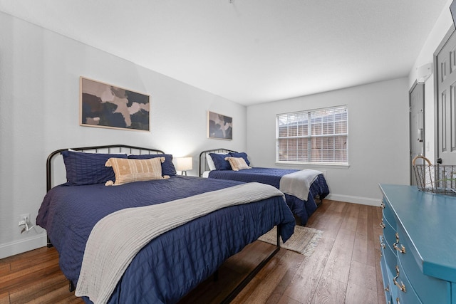 bedroom featuring dark hardwood / wood-style flooring