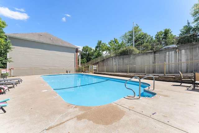 view of swimming pool featuring a patio