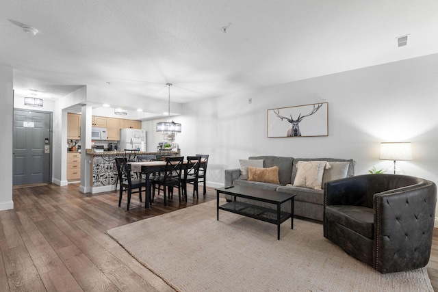 living room with dark wood-type flooring