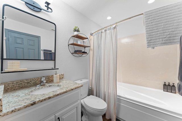 full bathroom featuring vanity, shower / bath combination with curtain, and toilet