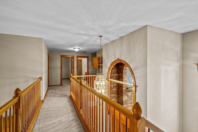 corridor with light colored carpet