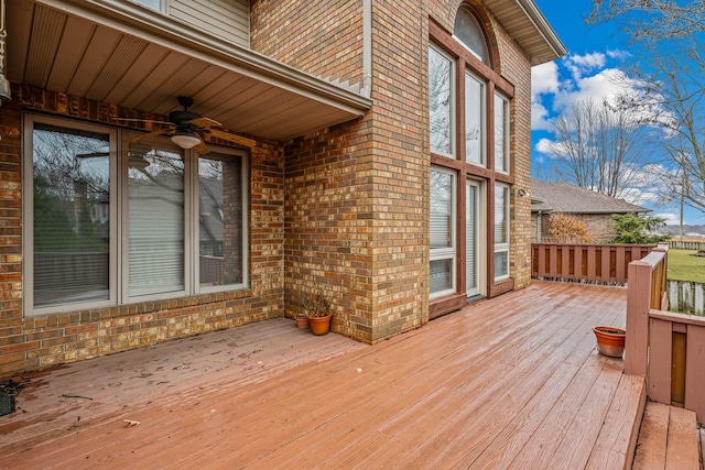 wooden terrace featuring ceiling fan