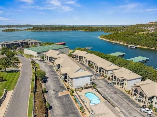 birds eye view of property featuring a water view