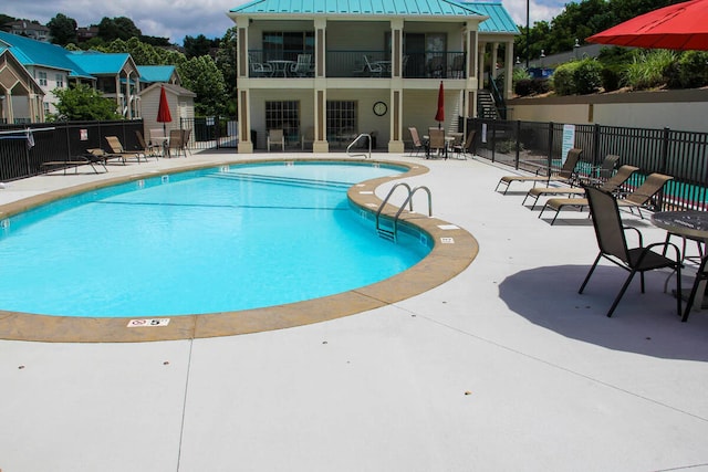 135 Upper Emerald Bay Cir Unit G-5, Hollister, MO 65672 - pool featuring fence, stairs, and a patio area