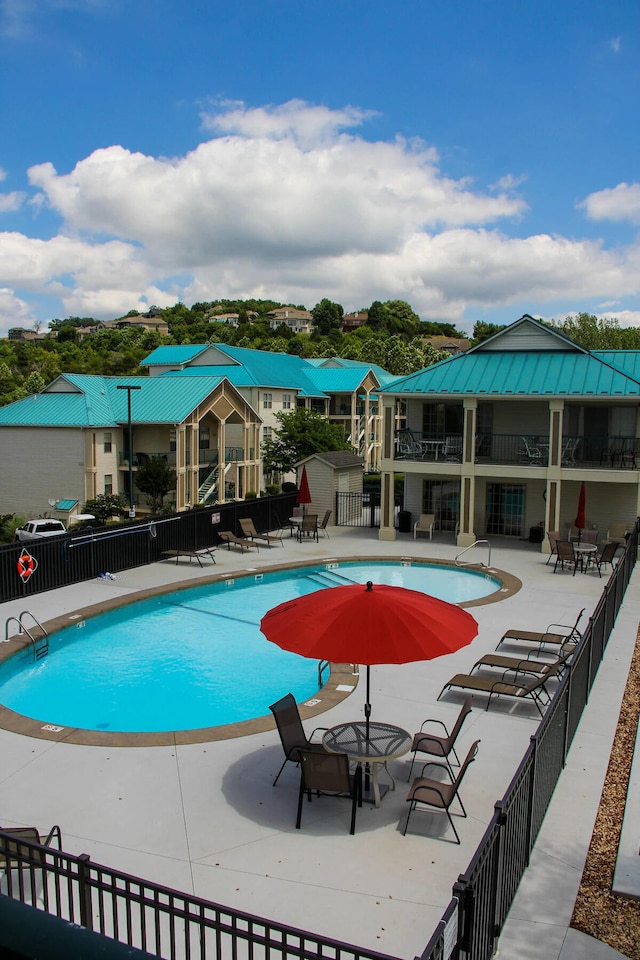 135 Upper Emerald Bay Cir Unit G-5, Hollister, MO 65672 - pool with fence and a patio area