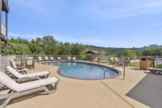 135 Upper Emerald Bay Cir Unit G-5, Hollister, MO 65672 - community pool featuring a patio area and fence