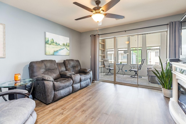135 Upper Emerald Bay Cir Unit G-5, Hollister, MO 65672 - living room with ceiling fan and wood finished floors