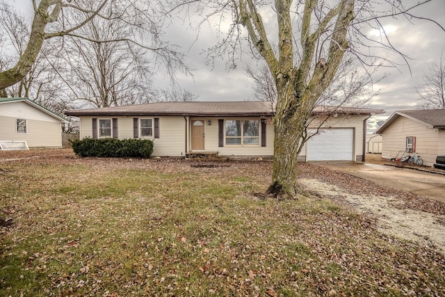 ranch-style home with a garage and a front yard