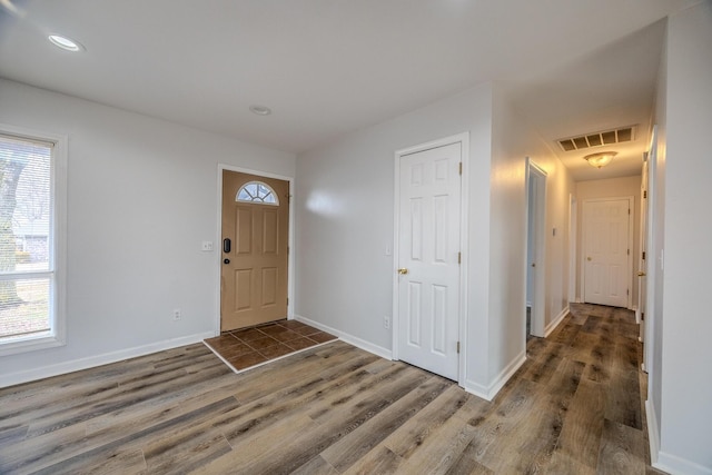 entrance foyer featuring dark wood-type flooring