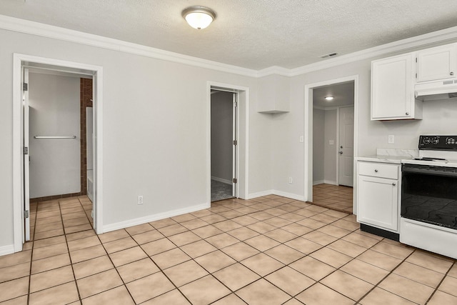 kitchen with crown molding, a textured ceiling, light tile patterned floors, electric range, and white cabinets