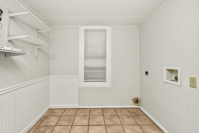 laundry room featuring light tile patterned floors, hookup for a washing machine, and hookup for an electric dryer