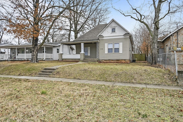 view of front of property with a front lawn and covered porch