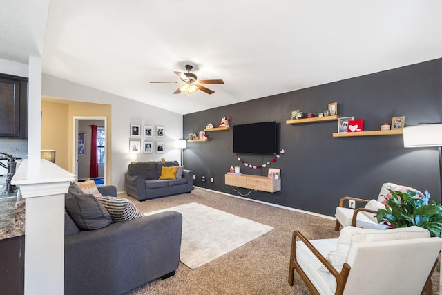 living room featuring lofted ceiling, carpet, and ceiling fan