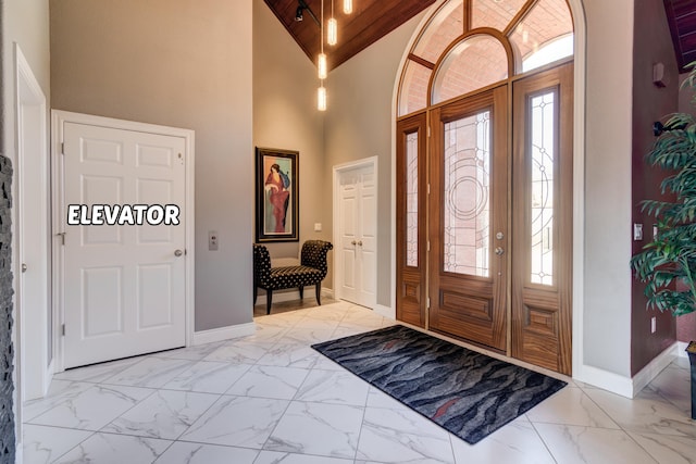 entryway with high vaulted ceiling