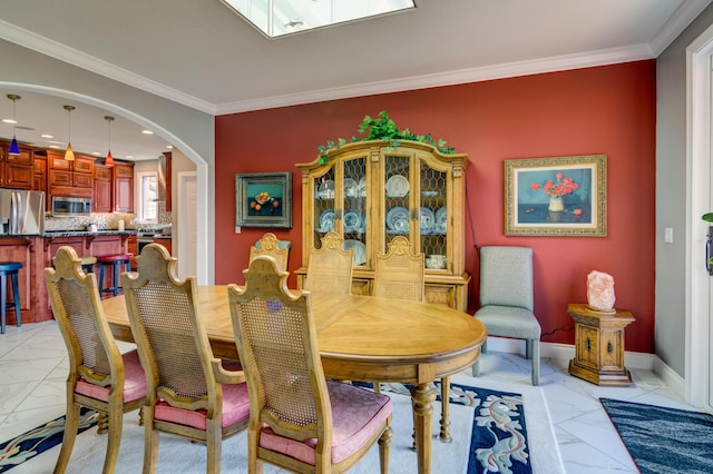 dining room featuring ornamental molding