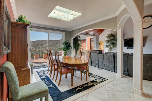 dining area with crown molding