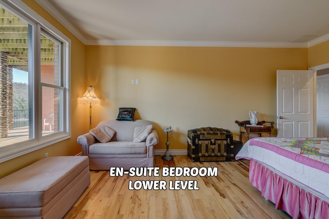 bedroom with light hardwood / wood-style flooring and ornamental molding