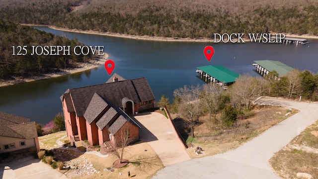 birds eye view of property featuring a water view