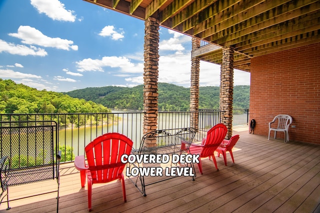 deck featuring a water view