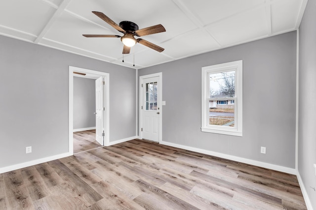 spare room with ceiling fan and light wood-type flooring