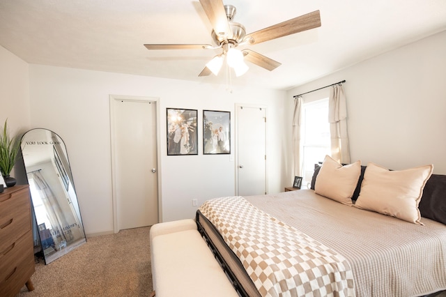 carpeted bedroom with ceiling fan