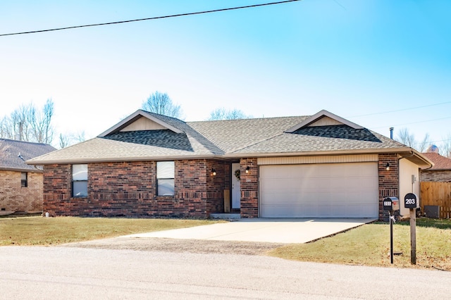 ranch-style house with a garage and a front lawn