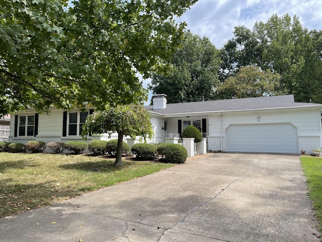 view of front facade with a garage and a front yard