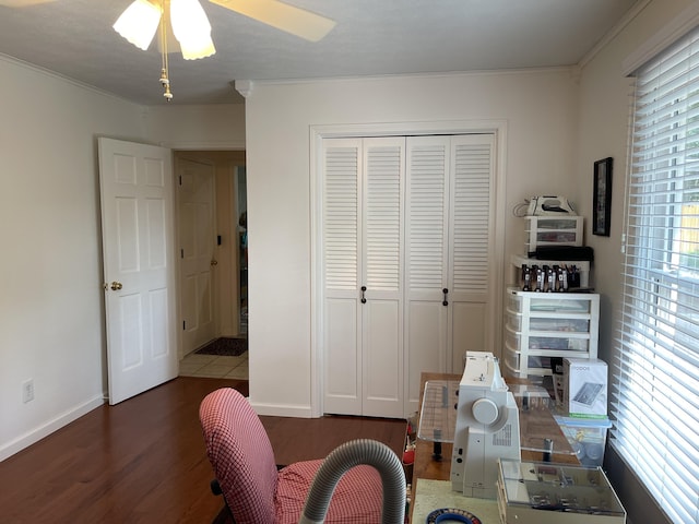 home office with dark wood-style flooring, crown molding, and baseboards