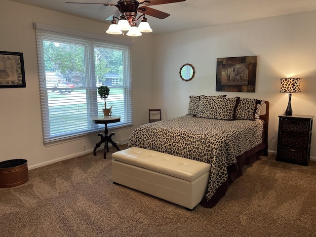 bedroom featuring carpet floors, baseboards, and a ceiling fan