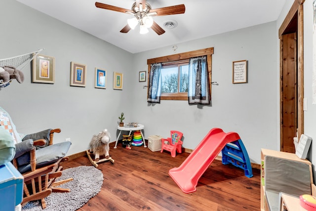 game room featuring wood-type flooring and ceiling fan