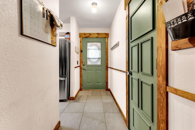 doorway to outside featuring light tile patterned floors