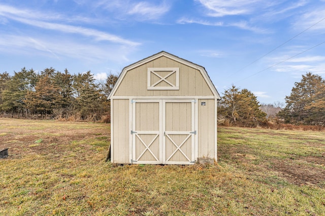 view of outbuilding featuring a yard