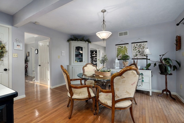 dining area with light hardwood / wood-style flooring