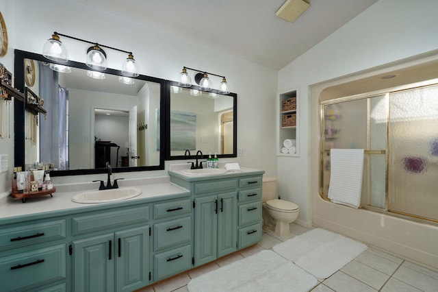 full bathroom with lofted ceiling, toilet, tile patterned floors, shower / bath combination with glass door, and vanity