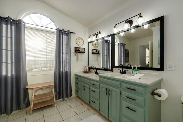 bathroom featuring vaulted ceiling, tile patterned floors, and vanity