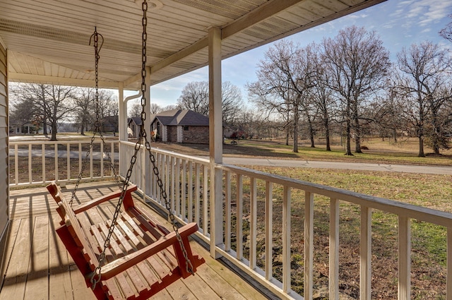 wooden deck featuring covered porch