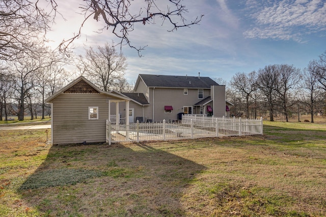 rear view of house with a yard, a swimming pool, and a patio