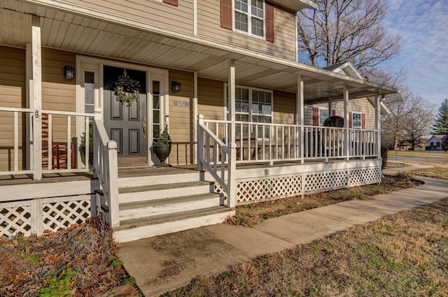 doorway to property featuring covered porch