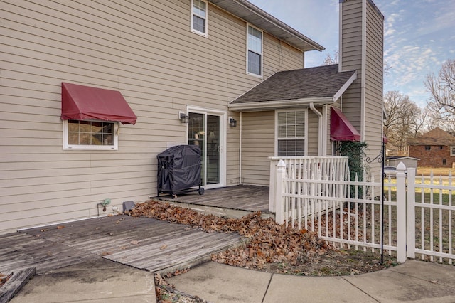 entrance to property with a wooden deck