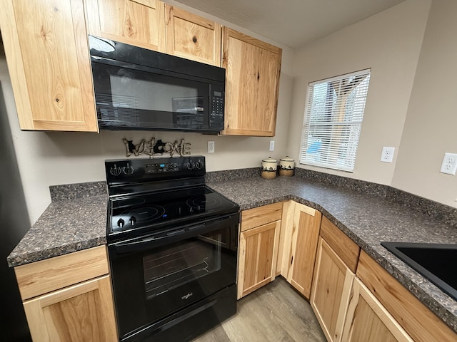 kitchen with sink, light hardwood / wood-style floors, light brown cabinets, and black appliances