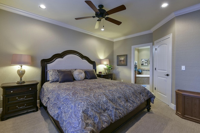 carpeted bedroom with ceiling fan, ensuite bath, and ornamental molding