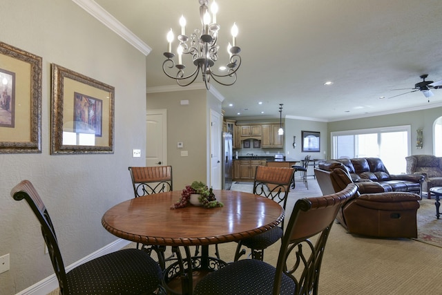 carpeted dining space with crown molding and ceiling fan with notable chandelier