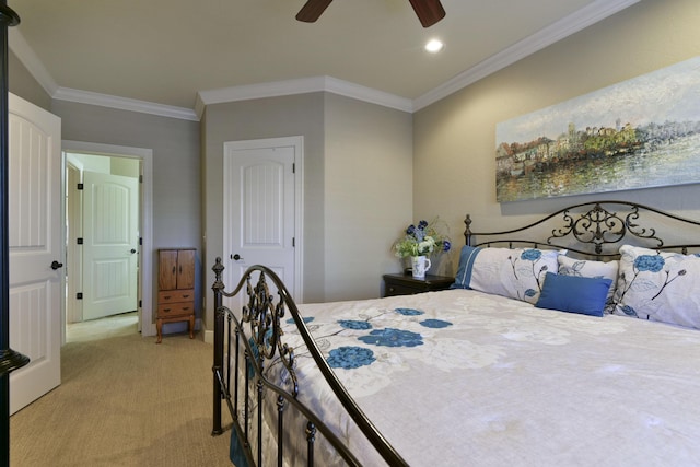 bedroom with crown molding, light colored carpet, and ceiling fan