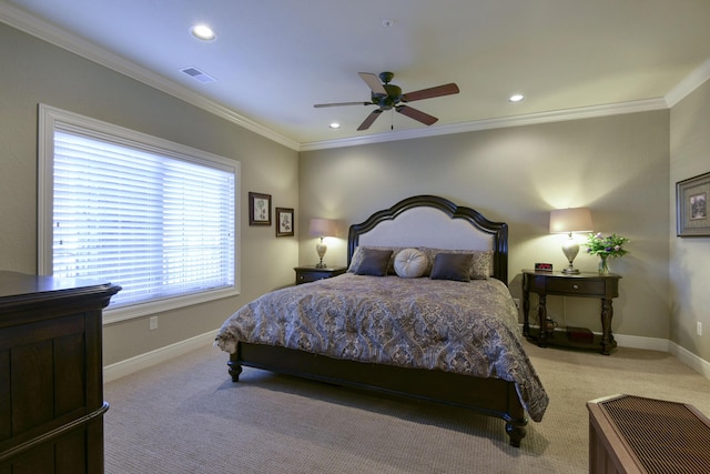 carpeted bedroom with ornamental molding and ceiling fan