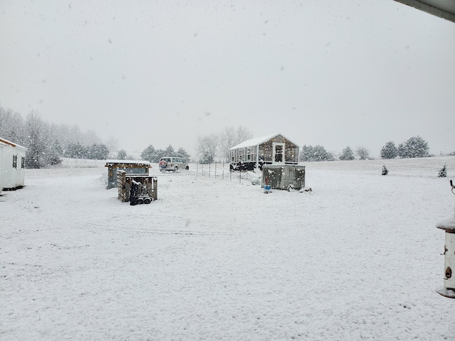 view of yard layered in snow