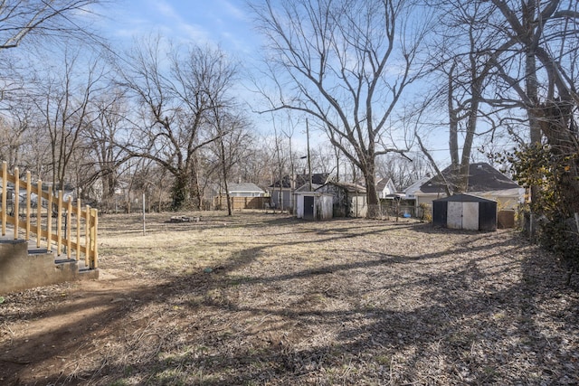 view of yard featuring a storage unit